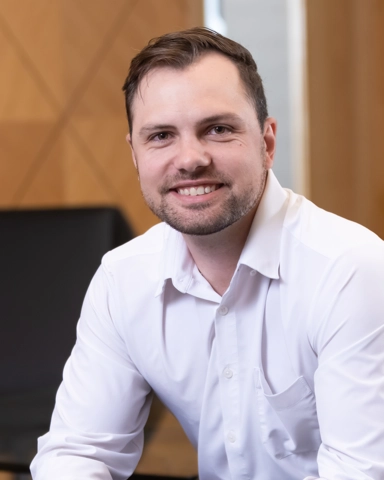 portrait of a smiling person in professional attire